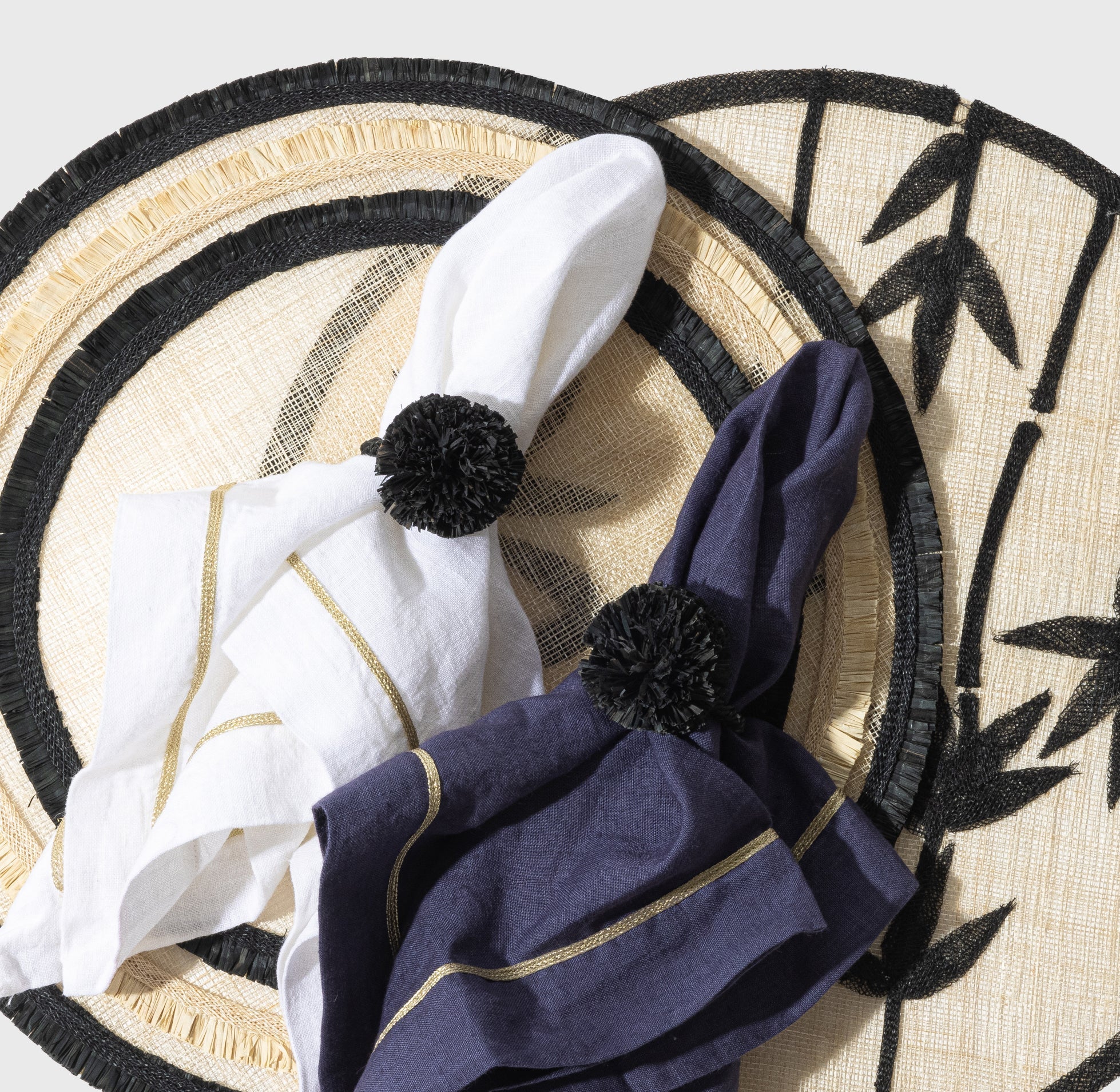 Straw Pompom Napkin Rings in Black, Set of Four