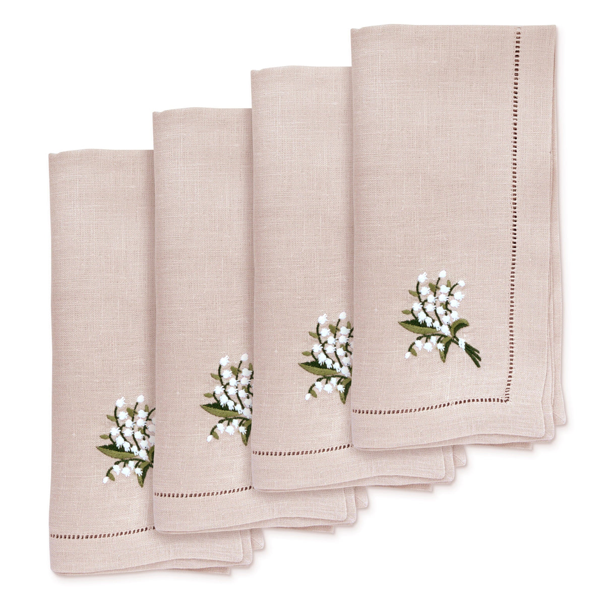 Overhead view of Lily of the Valley Dinner Napkins showcasing embroidered flowers and openwork border on white background