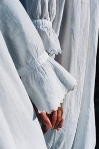 Cuff detail of scalloped edge on nightgown