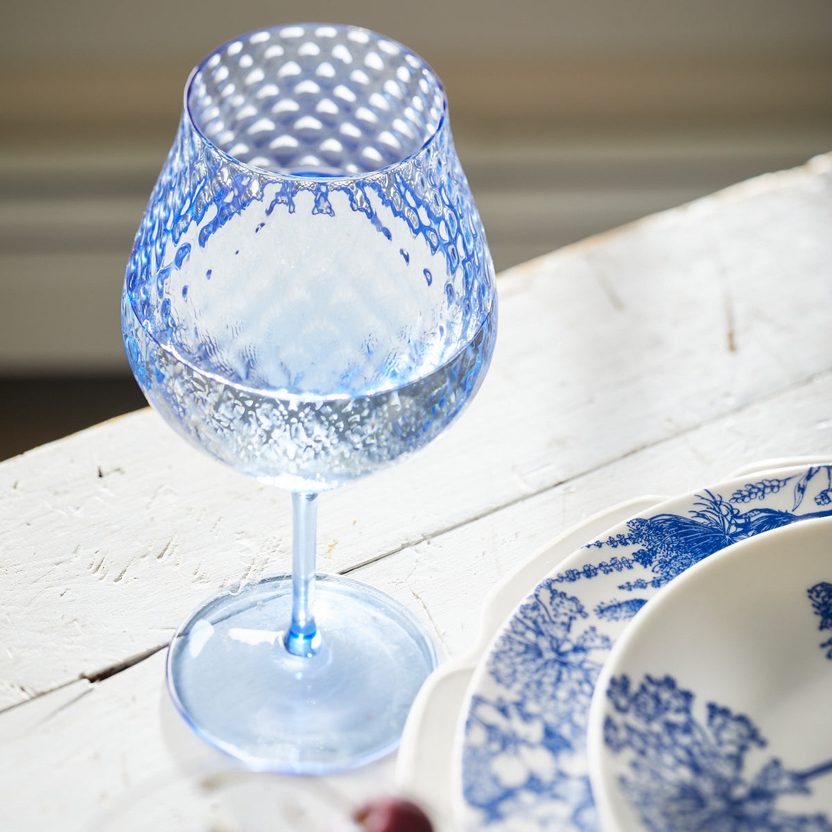 Phoebe cobalt blue mouth blown diamond optic crystal universal wine glass from Caskata.