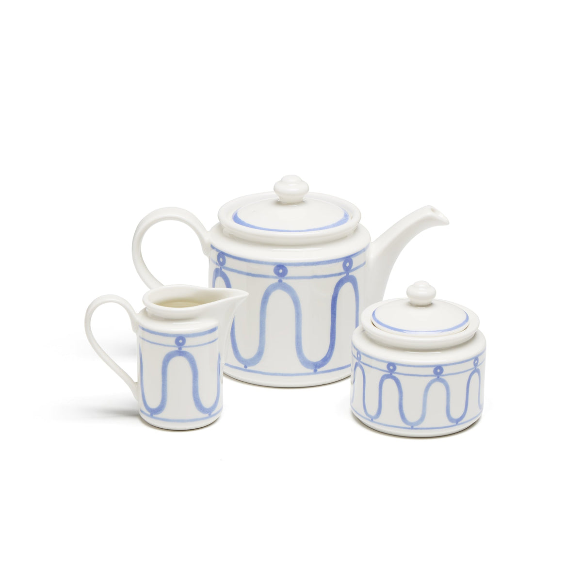 Front view of The Serenity Blue Tea Set showcasing blue geometric patterns on three porcelain pieces with white background