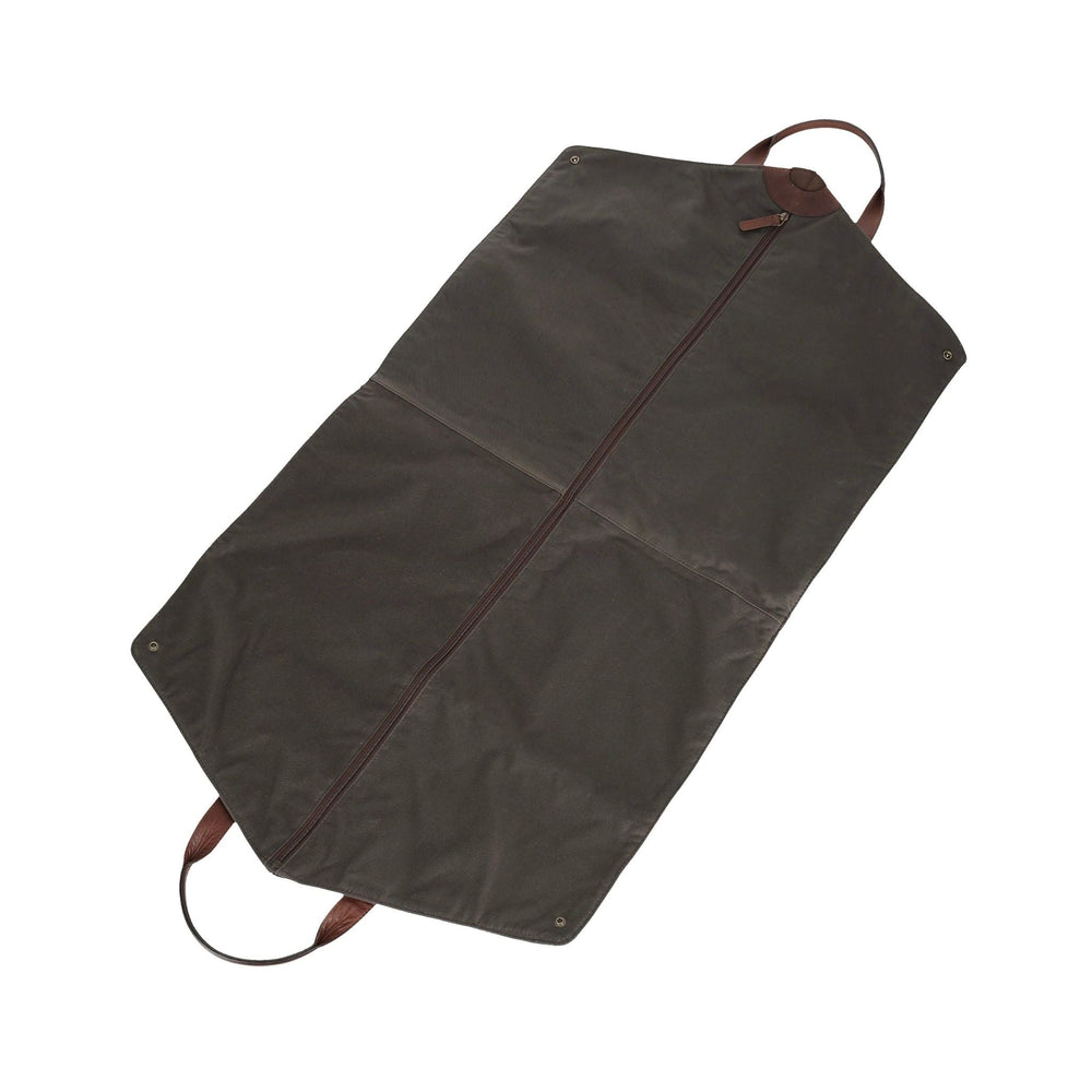 Top-down view of wax canvas travel garment bag in bark brown with center zipper, leather handles, and snap corners on white